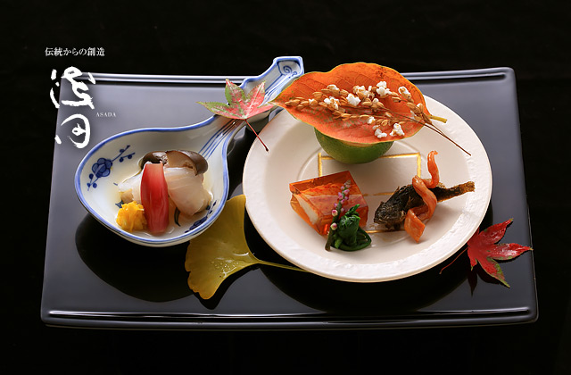 Seasonal Kaga cuisine arranged in autumn vessels at Akasaka Asada