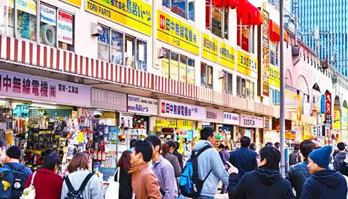 Crowds browsing specialist electronics and parts shops in Akihabara