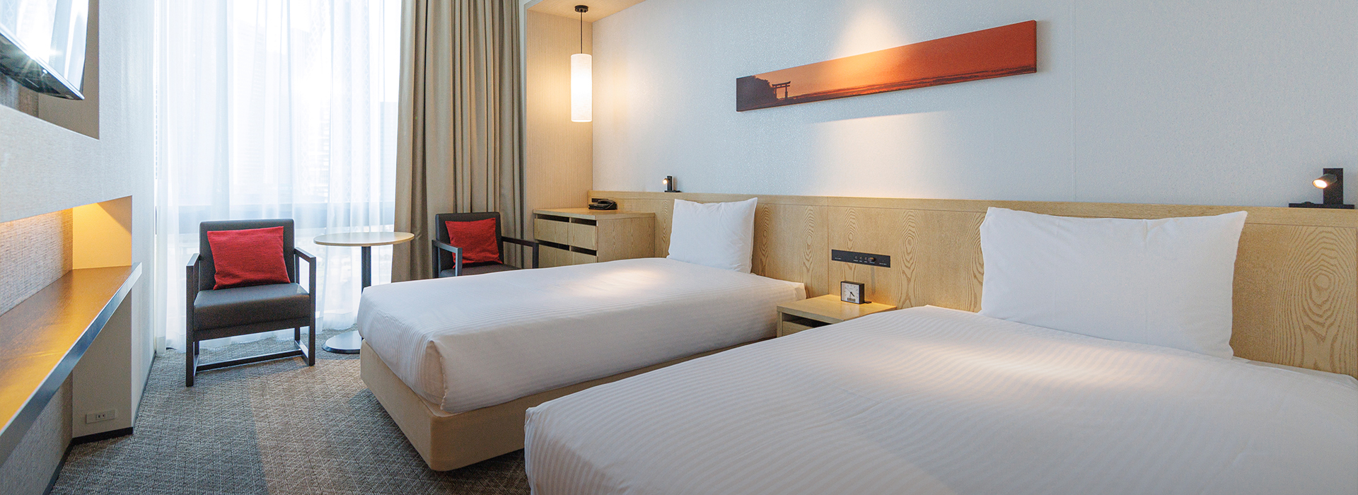Two beds and window-side seating in a Superior Twin at JR KYUSHU HOTEL Blossom Shinjuku