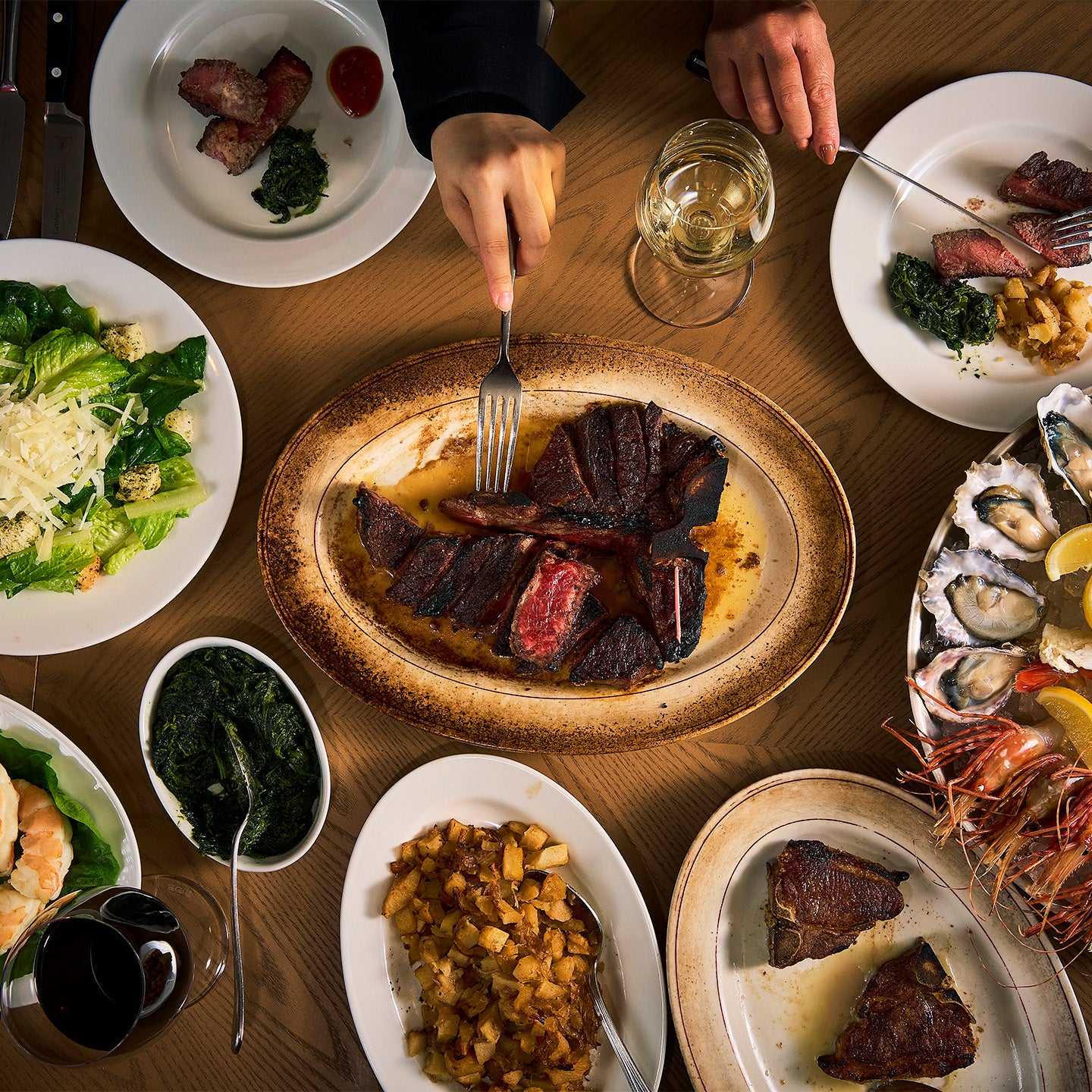 T-bone steak being shared at Peter Luger Steak House Tokyo