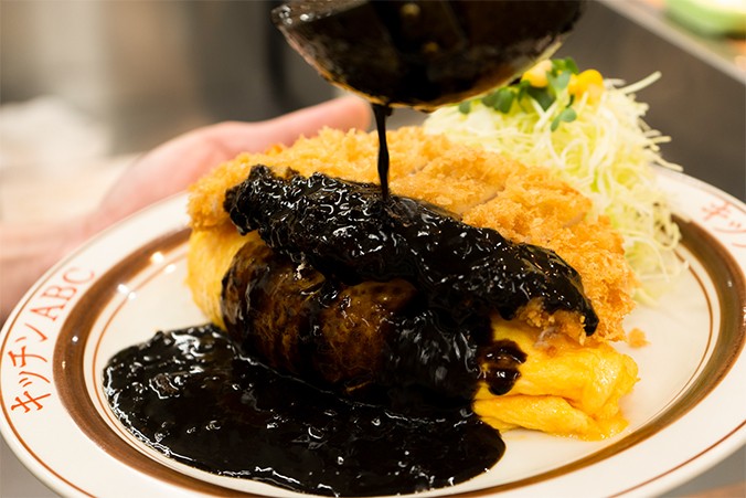 Black curry poured over a yoshoku plate at Kitchen ABC