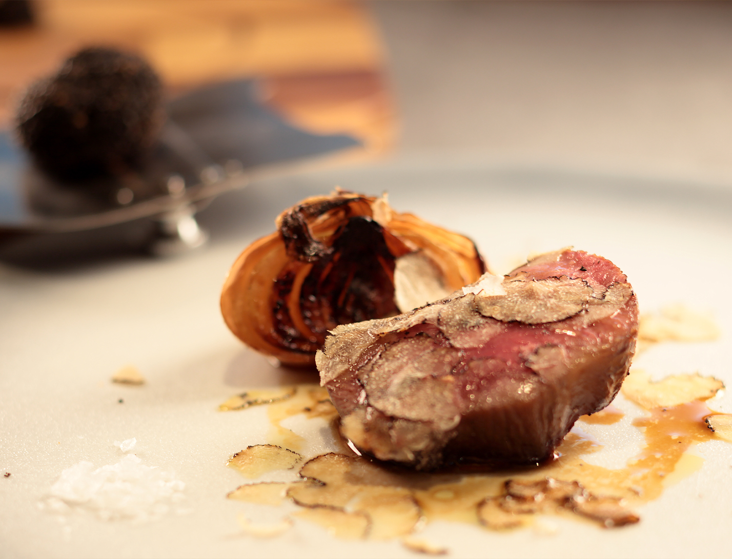 Onda Tokyo meat dish with roasted onion and shaved truffle
