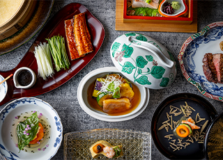 Japanese course dishes in patterned tableware at Japanese Restaurant Sakura