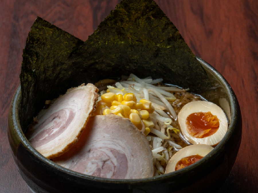 Bowl of miso ramen with pork, egg, corn, bean sprouts and seaweed at Do Miso
