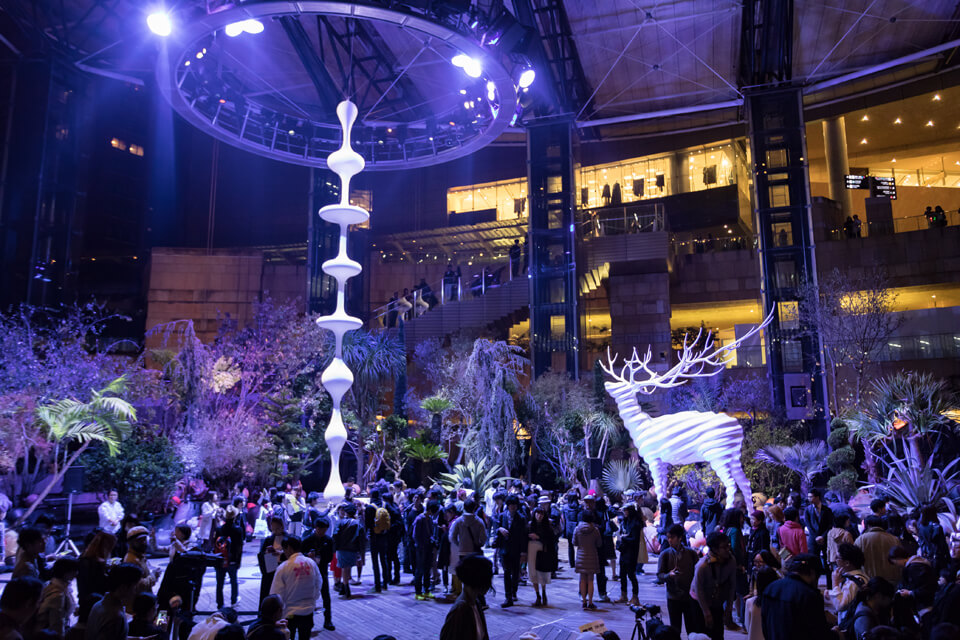 Crowds among illuminated installations at a past Roppongi Art Night